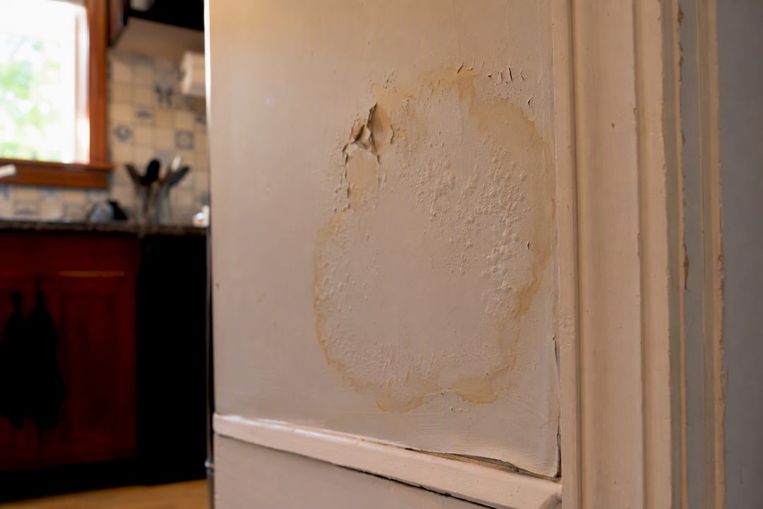Drywall with water stain and peeling paint