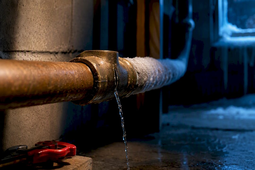 Split pipe joint leaking in winter basement