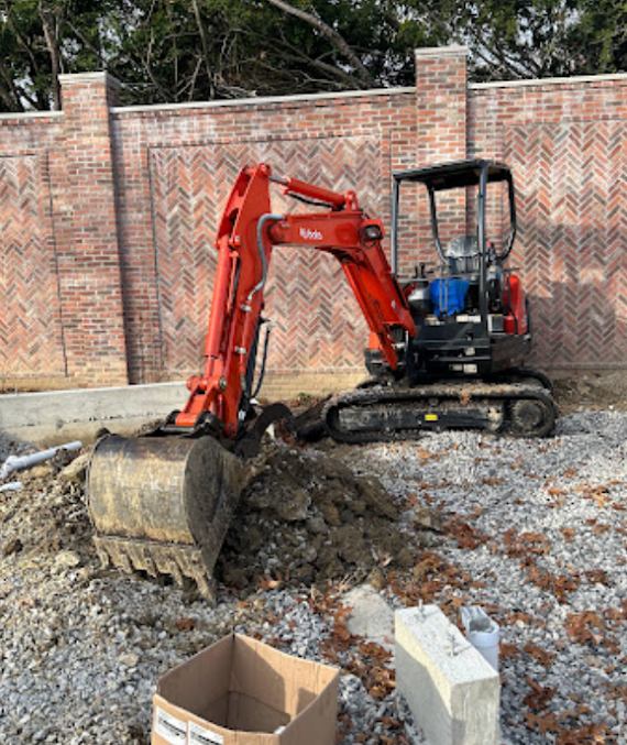 Mini excavator at an AG Plumbing worksite